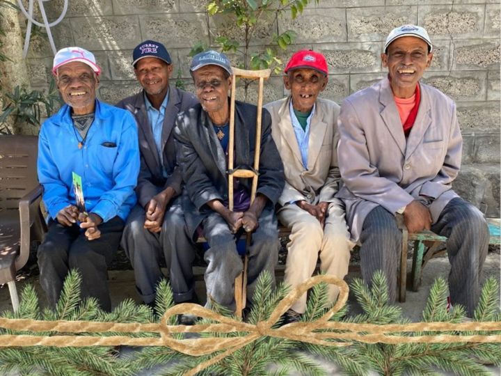 Group of elderly men living with leprosy at compound where they live