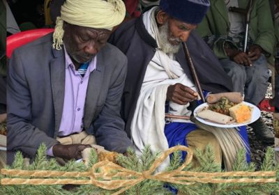 Elderly men at community feeding program in Korah Ethiopia