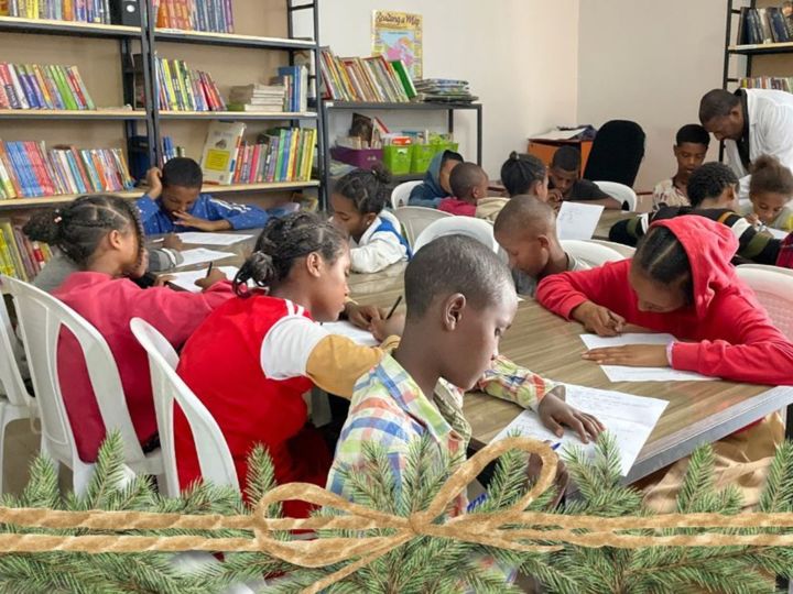 children studying at tables in Hope for Korah library Ethiopia