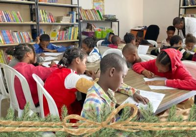 children studying at tables in Hope for Korah library Ethiopia