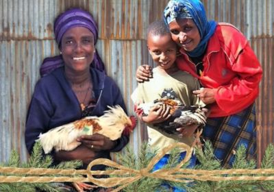 families holding chickens in Korah Ethiopia