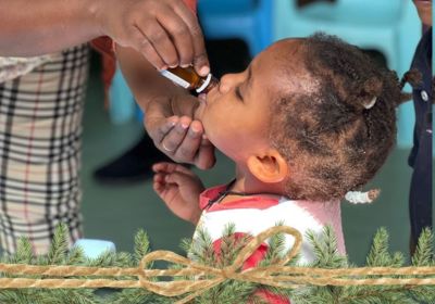 young child receiving deworming medication in Korah Ethiopia